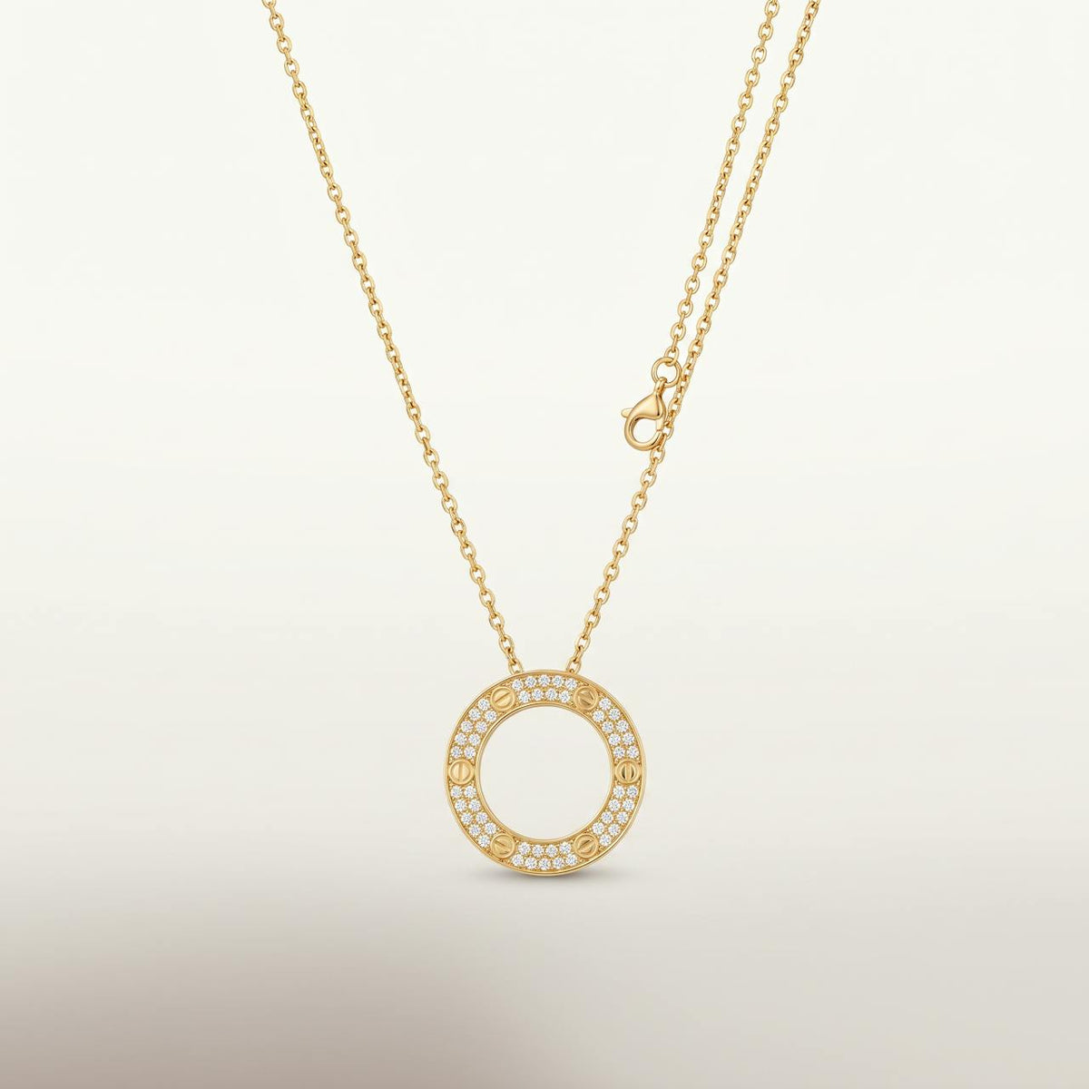 Collier doré pendentif cercle entierement pave de pierres sur fond ivoire